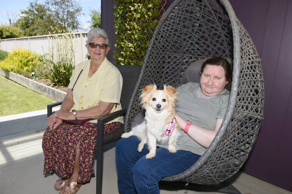 NEW FRIENDS: Eva Kerr and Maree Lee with Missy, who sparked an initial conversation between the neighbours that has developed into a firm friendship. Picture: Kate Healy
