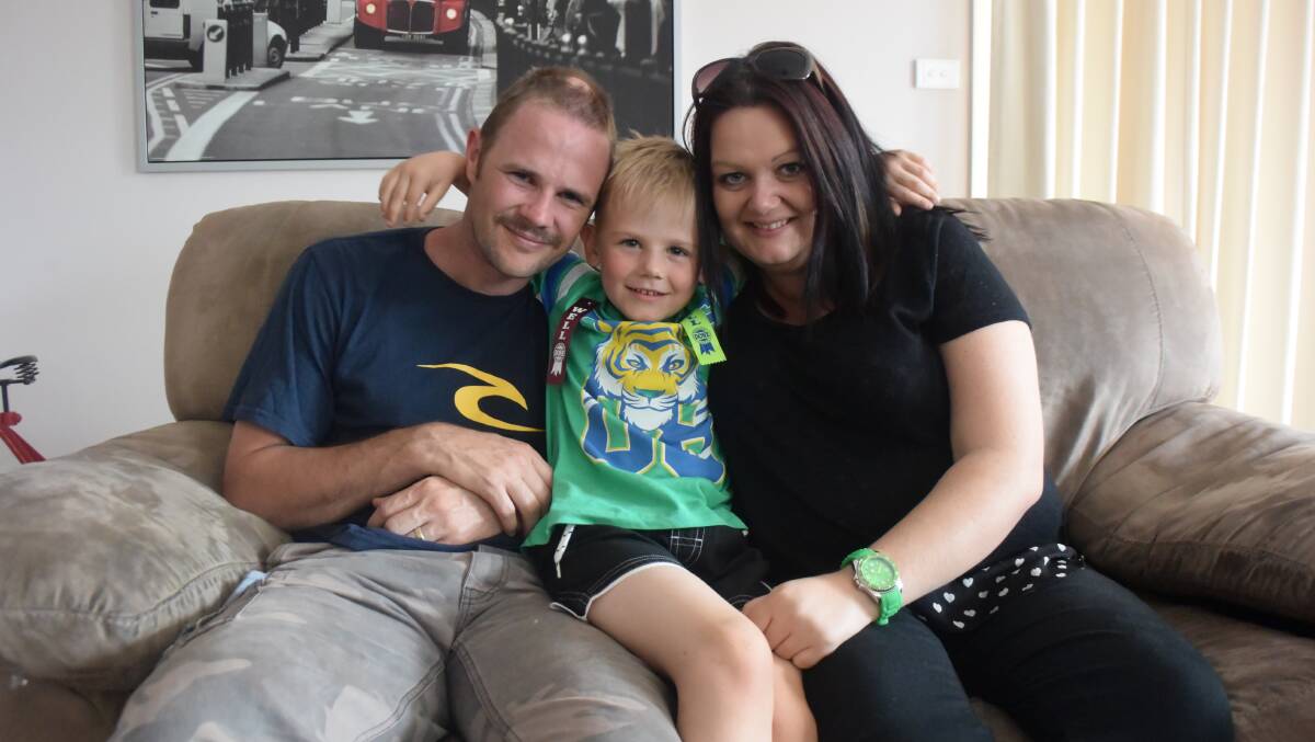 FAMILY: Ethan with his parents in 2015, not long after he underwent 16 hours of life-saving surgery at the Royal Children's Hospital.