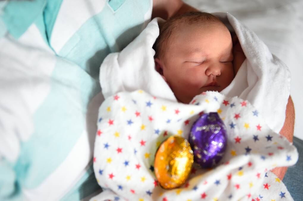 One-day-old Maggie Coates enjoys her first Easter safe in the arms of mum at Ballarat Health Services.