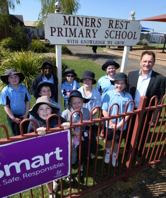 GROWING PAINS: Miners Rest Primary School principal Dale Power and students at the burgeoning school. Picture: Lachlan Bence