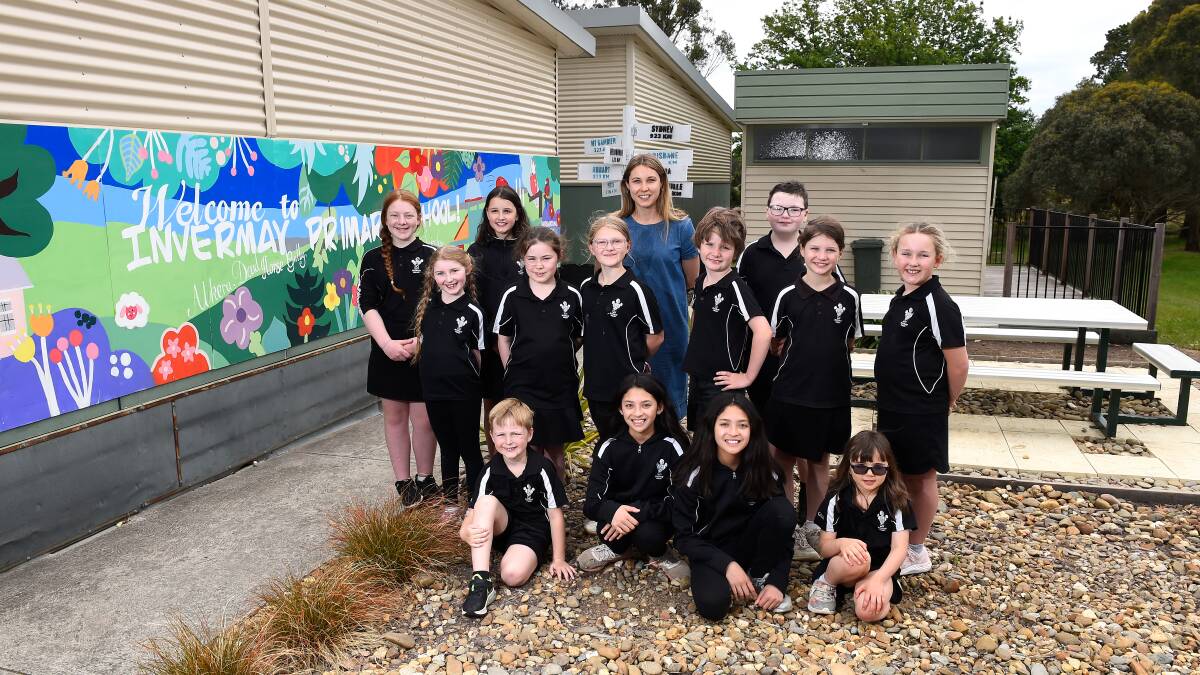 COLOURFUL: Artist in residence Rachel King and some of the young Invermay Primary artists who helped design the new school mural. Picture: Adam Trafford