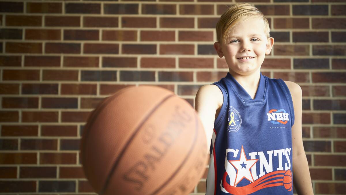 ACTIVE: Ethan is thriving for now and playing competitive basketball which he loves, but he will face further heart surgeries and possibly need a heart transplant in the future. Picture: Luka Kauzlaric