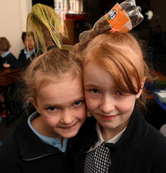 STYLE: Grade three pupil Eleanor crafted her hair in to a palm tree while Astrid, grade four, had a bottle style. Picture: Lachlan Bence