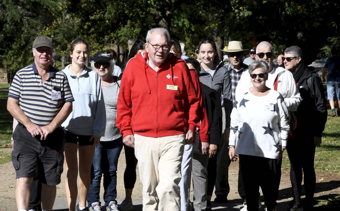Heartbeat coordinator Barry Nixon leads walkers including Deakin University medical students Seda Catak, Alicia Chan and Lauren Martin. Picture by Lachlan Bence
