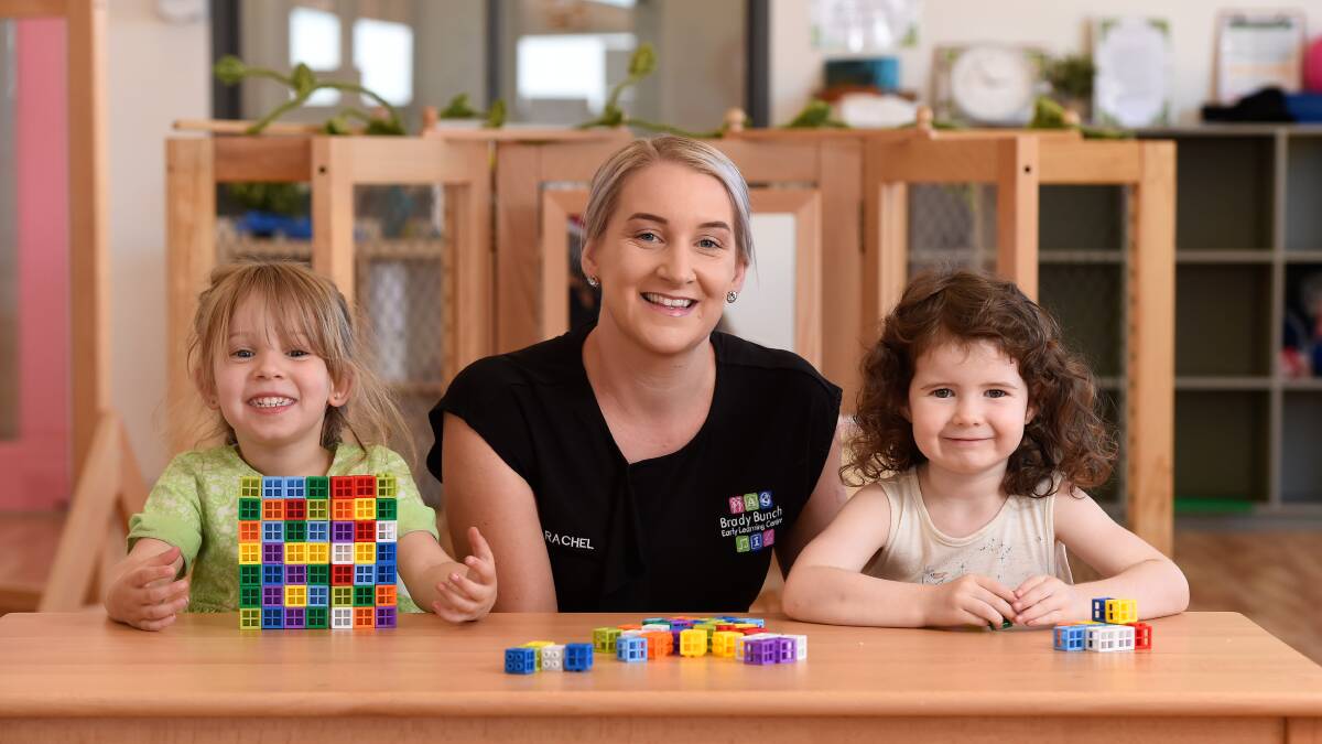 PLAYTIME: Rachel Condon with Matilda and Ava in one of the six rooms of the new Brady Bunch Early Learning Centre in Delacombe. Picture: Adam Trafford