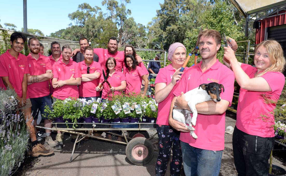THINK PINK: Carole, David and Joanna with dog Earl and the staff of Avalon Nursery get ready for their fundraising headshave. Picture: Kate Healy