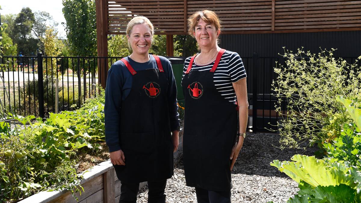 Mount Rowan Secondary College canteen staff Chloe Hewitt and Jody Burgess in the kitchen garden where they harvest some of the produce for the school canteen. Picture by Adam Trafford