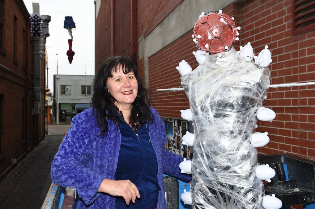 LIT: Artist Melinda Muscat with her sculpture that will hang high above Police Lane and draw visitors through to Alfred Deakin Place as part of the Ballarat Winter Festival's Laneway Lumieres. Pictures: Kate Healy