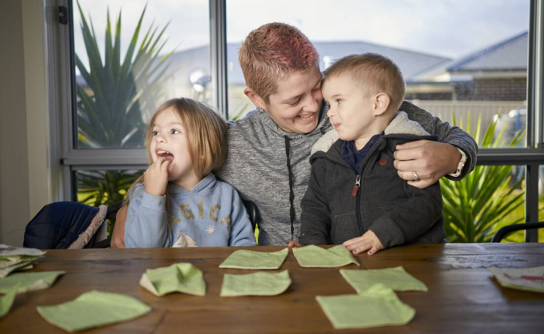 FUTURE: Kleo, Kyllie and Nixon Garrett play a matching game at their Delacombe home as Kyllie  looks ahead to having stem cell treatment to halt the progression of multiple sclerosis. Picture: Luka Kauzlaric