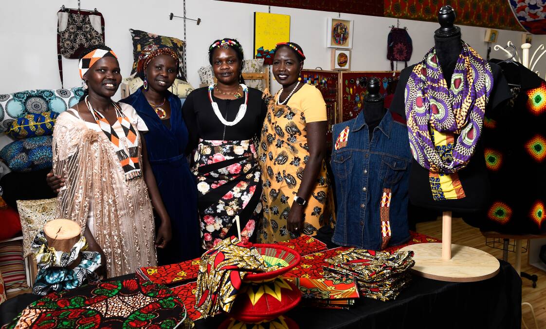 Mary Deng (Nyaluak), Nyibol Deng, Martha Chol, and Mary Top at the opening of the Women of the Well retail store in Bridge Mall. Picture by Adam Trafford