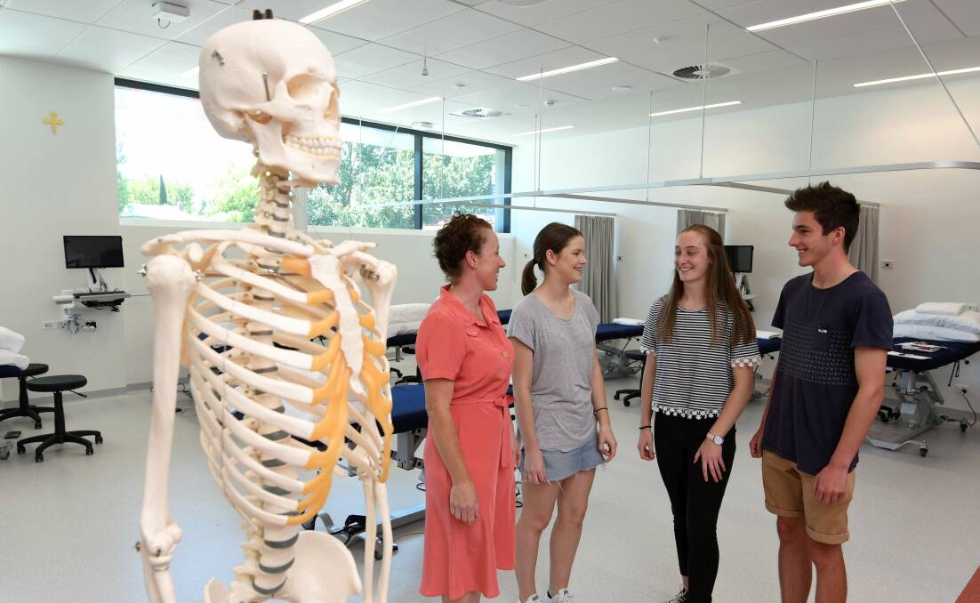PHYSIO: ACU's Rebecca Lane welcomes Emily Mewett, Abbey Cartledge and Flynn Jamieson to the physiotherapy course. Picture: Lachlan Bence
