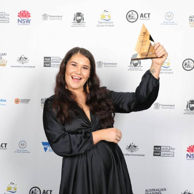 ELATION: Alyssa Heard celebrates with her runner-up trophy in the Australian Apprentice of the Year for Commercial Cookery award.