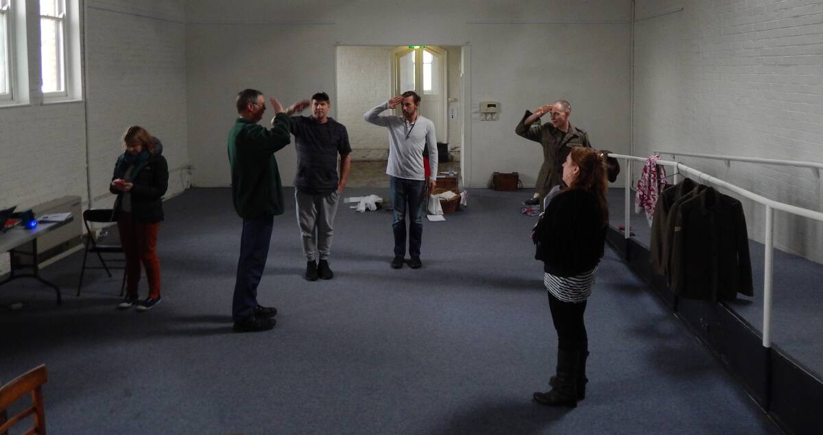 SALUTE: The cast undergo salute training with Ballarat Ranger Military Museum manager and retired army major Neil Leckie