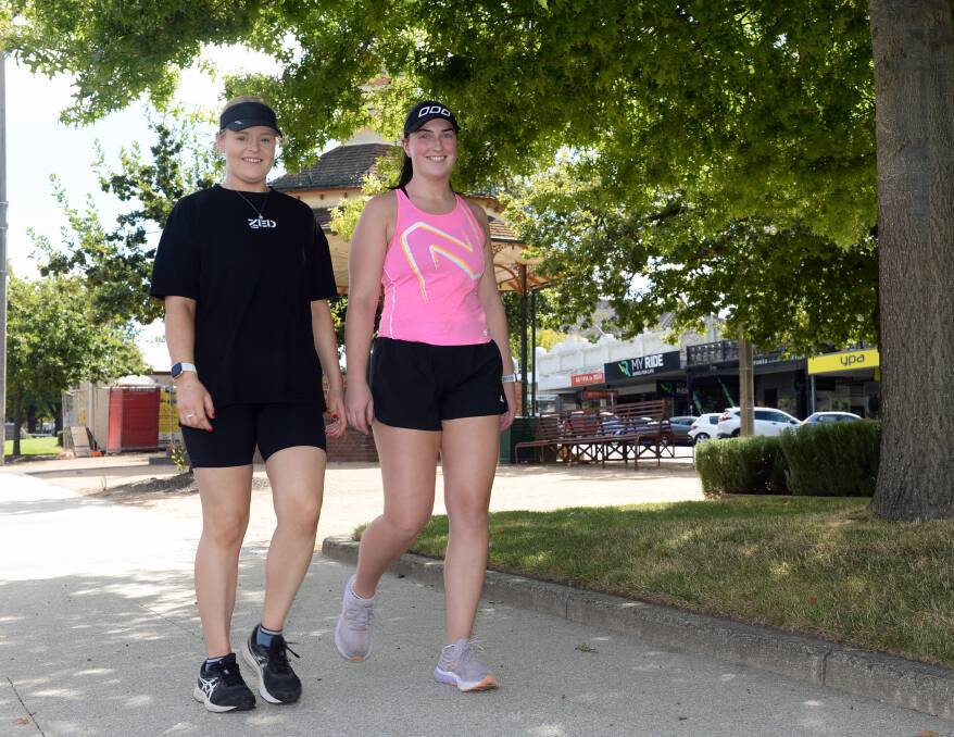Lily Gibson and Caitlyn Knight competed many of their 100,000 steps along Sturt Street on Saturday. Picture by Kate Healy