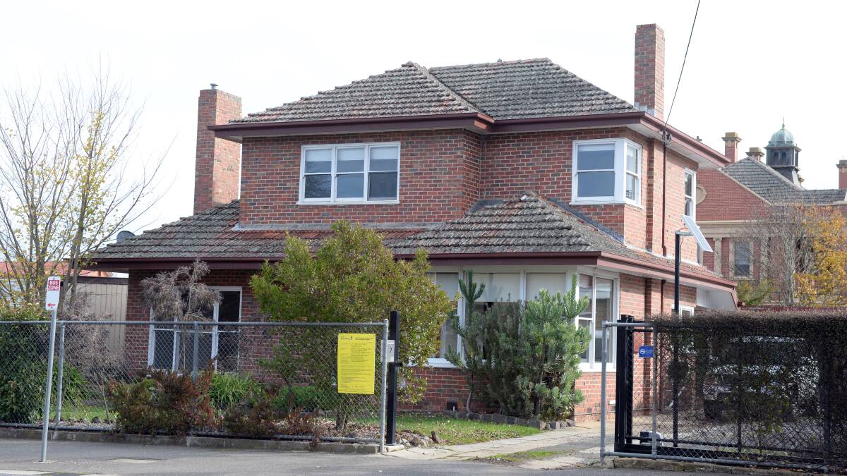 GOING: The two-storey house at 2 Wanliss Rd which could be demolished to make way for the new multi-purpose centre. Picture: Kate Healy