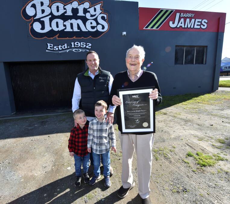 FAMILY BUSINESS: Barry James, son Glen and grandsons Tanner and Easton with a certificate from the VACC marking 75 years in the smash repair business. Picture: Jeremy Bannister