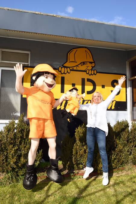 CELEBRATION: KIDS Foundation founder Susie O'Neill with the organisation's mascot Seemore Safety outside their headquarters in Burnbank St, Ballarat. Picture: Kate Healy