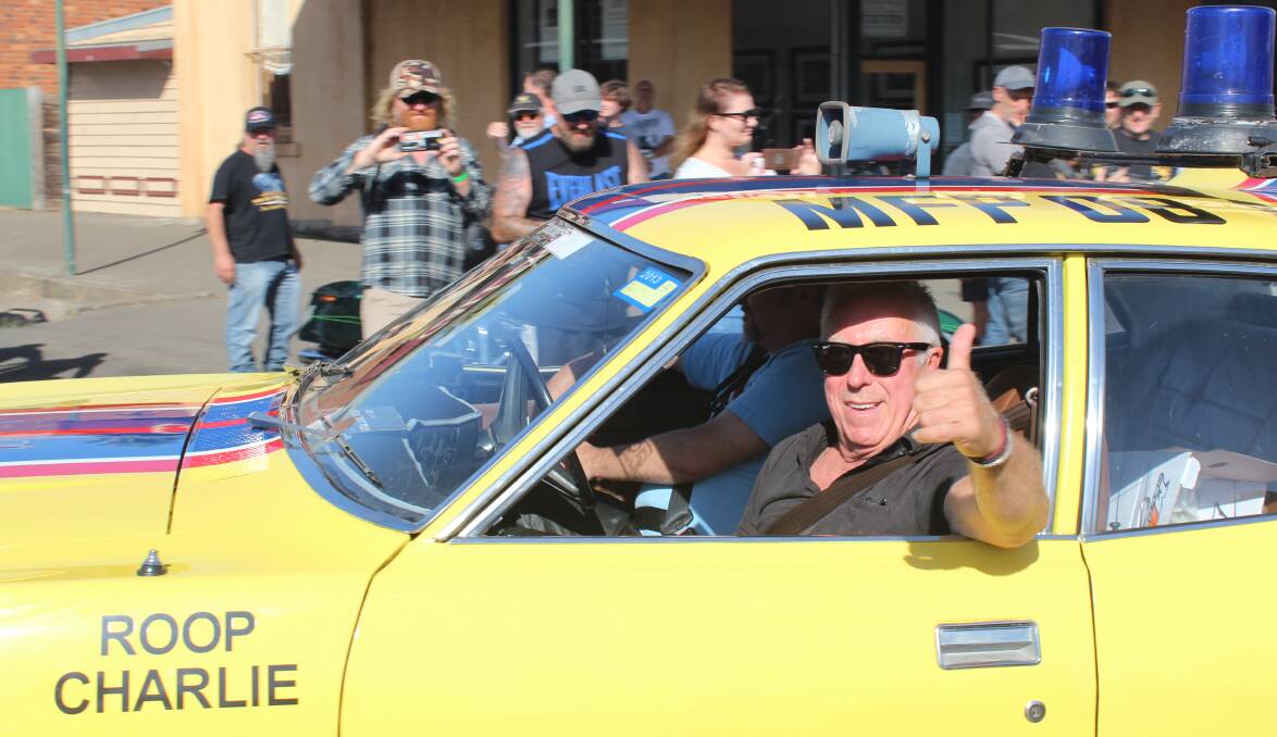 CLASSIC: Actor Steve Bisley, who played the Goose in Mad Max, gets a ride in the convoy to Carisbrook. Picture: Rochelle Kirkham