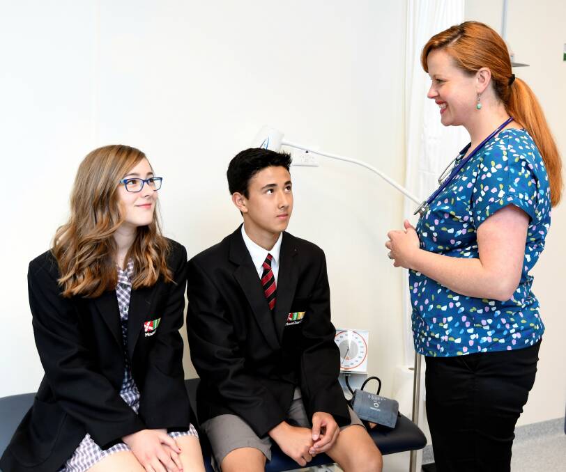 DOCTOR: Tiana Burge, 13, and Eddie Tanaka, 14, with nurse Lucy Hughes in Mount Clear College's doctor's surgery, part of the Doctors in Secondary Schools program. Picture: Lachlan Bence