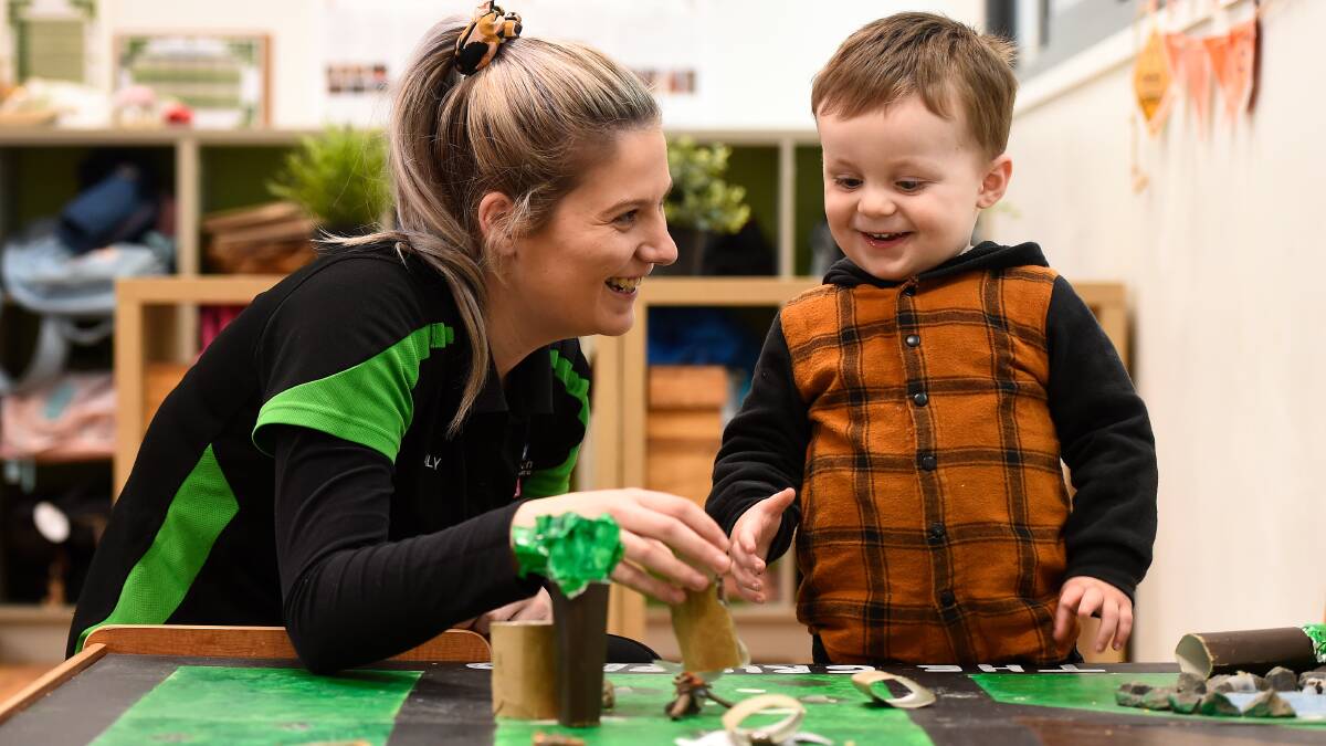 PLAYTIME: Brady Bunch Early Learning Centre educator Emily Organ gets creative with Oliver, 2. Picture: Adam Trafford 