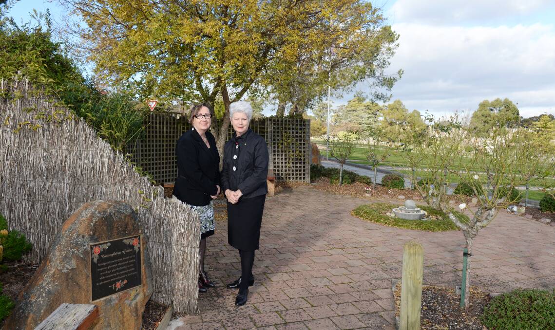 ANNIVERSARY: Ballarat Cemeteries Trust chief executive Annie De Jong and chair Judy Verlin visit the contemplation garden where families can place ashes while deciding on a permanent memorial for their loved ones. Picture: Kate Healy