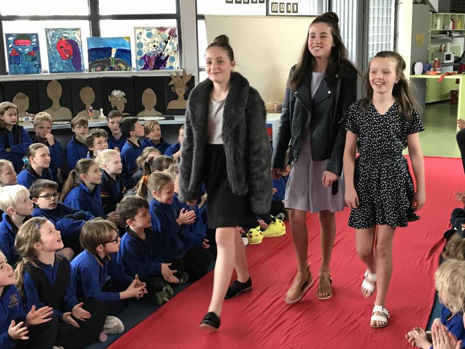STRUT: Charlotte, Tilly and Bonnie from CBT Productions walk the red carpet at Pleasant Street Primary School's film festival. Picture: Michelle Smith