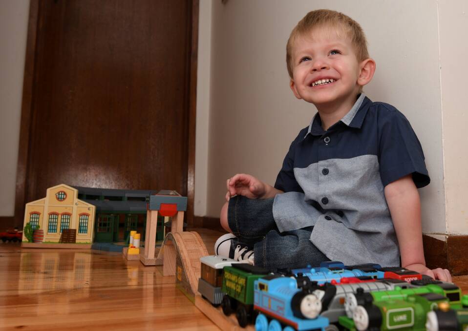 BRAVEHEART: Mihalis plays with his Thomas the Tank Engine toys. Picture: Lachlan Bence
