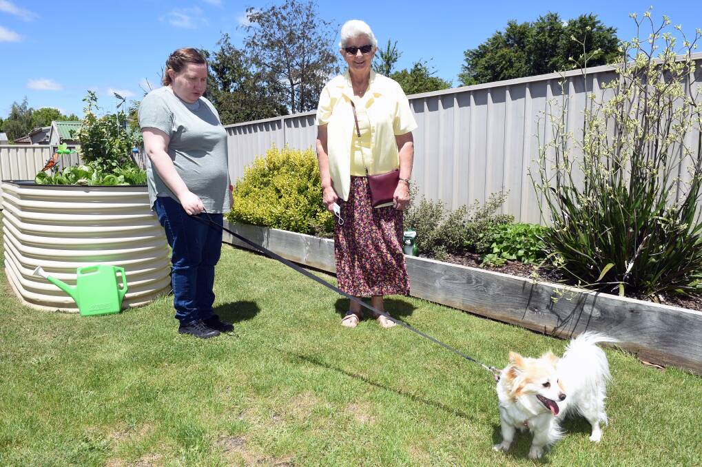 BONDING: Eva Kerr and Maree Lee with Missy in the back garden of Eva's Delacombe home. Picture: Kate Healy