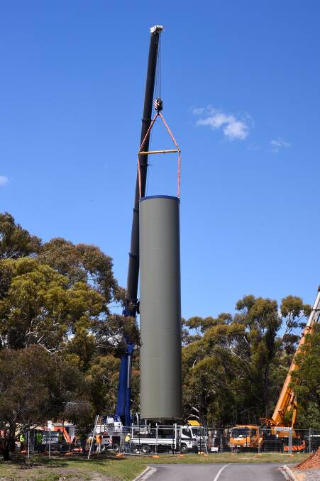 TRAINING: A giant crane lifts the 23m wind turbine training tower in to position. Picture: Adam Trafford