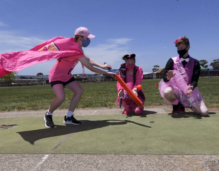 PINK: Mount Rowan Secondary College students Jasmine, Bridget and Cory got fully in to the spirit of Pink Stumps Day for the McGrath Foundation. Picture: Lachlan Bence