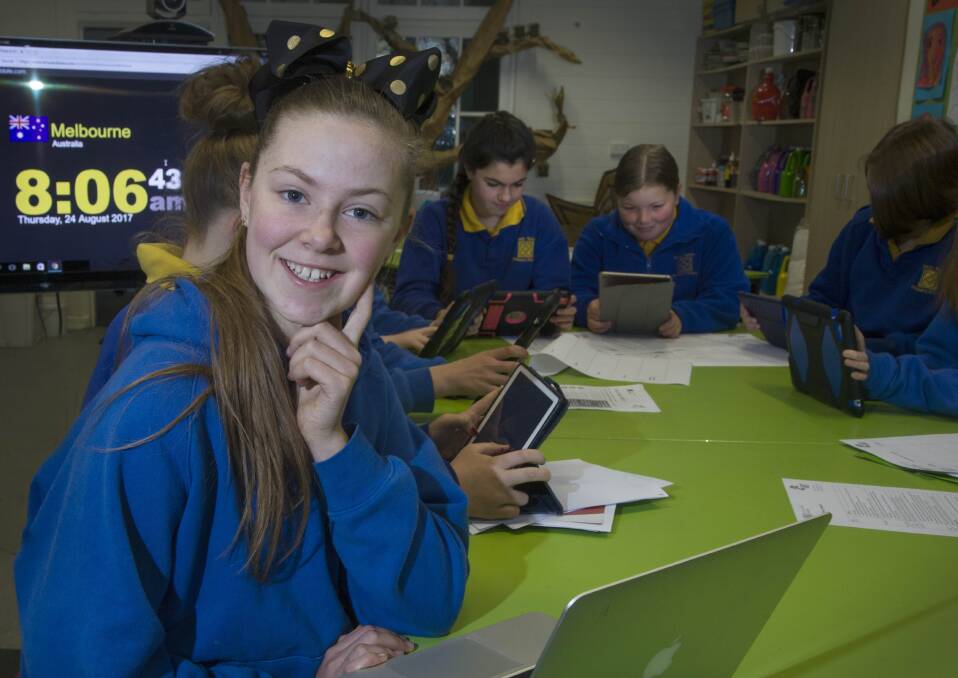LONG DAY: Sophie and her team mates from Woady Yaloak Primary ponder plot twists for the Write A Book in a Day challenge. Picture: Mark Smith 