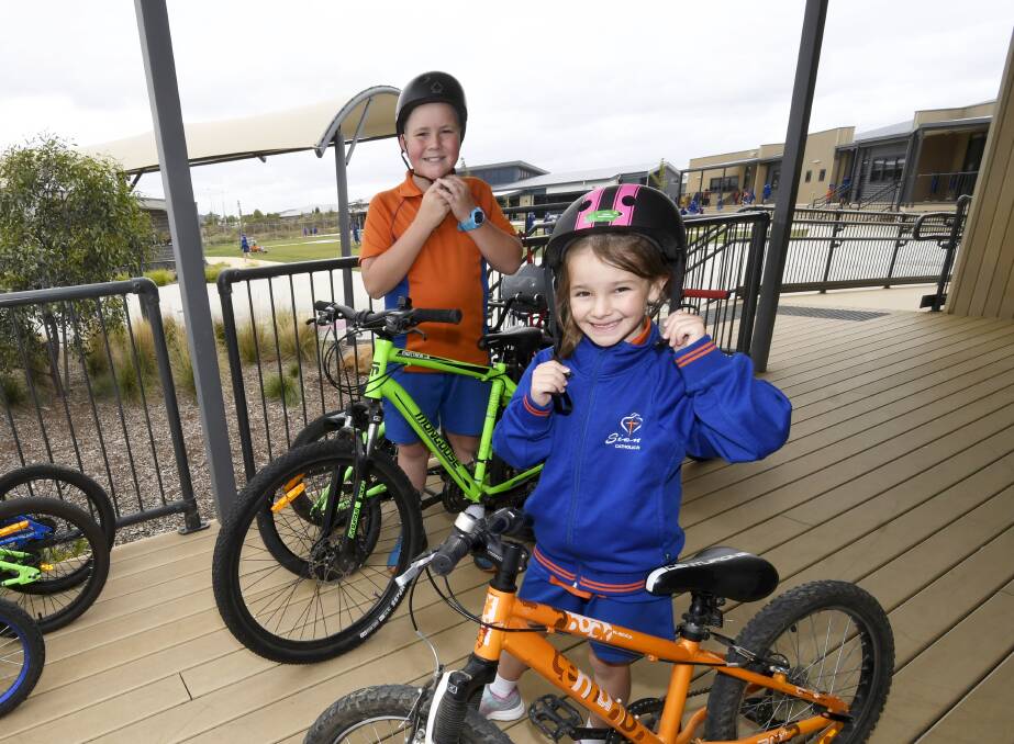 TWO WHEELS: Siena Catholic Primary pupils Will (grade six) and Maddy (grade two) are among a growing number of students from the local area choosing to ride to school. Picture: Lachlan Bence