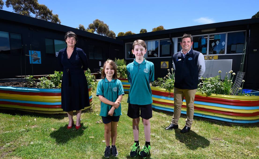 CHANGES: Buninyong MP Michaela Settle with Cape Clear Primary principal Lachlan Day and pupils Isabelle and Xavier. Picture: Adam Trafford