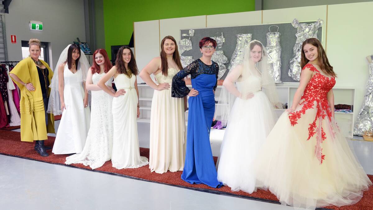 VET Applied Fashion Design and Technology trainer Jo Hall and students Tatum Millsom, Cindesty Lucas, Freya Manton, Isabella Munro, Adaleeta Watson, Bella Smith and Siena Grant. Picture by Kate Healy