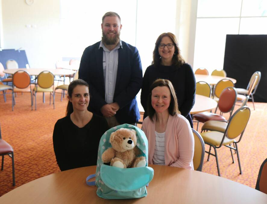 CARE PACK: Fed Uni's Leigh Byron, Katrina Kavanagh, Department of Health and Human Services' Bridie Baker and student Tracy Walter with a first night care pack. 