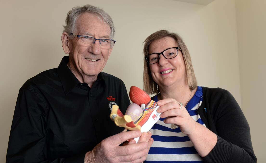 Ballarat businessman Peter Stevens and prostate cancer specialist nurse Gay Corbett with a model of a prostate. 