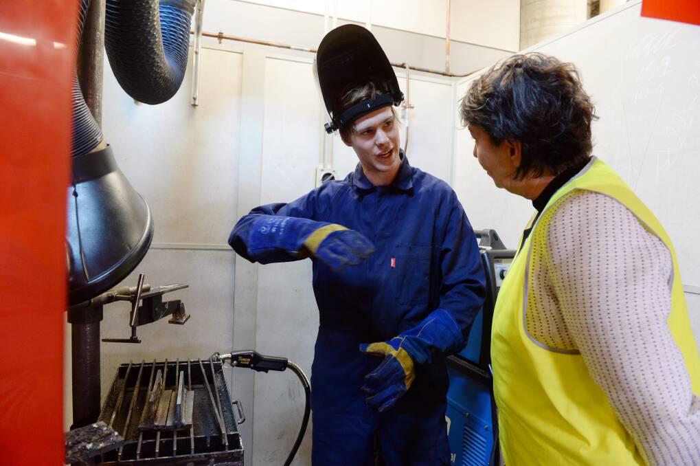 SKILLS SHORTAGE: Jarrod Sutcliffe explains the intricacies of welding to Buninyong MP Michaela Settle. Picture: Kate Healy