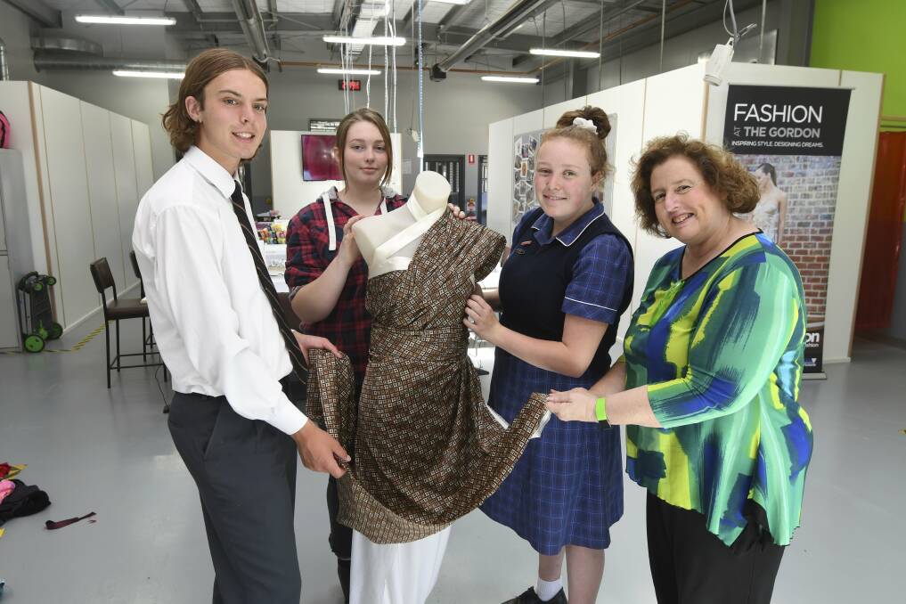 DESIGN: Students Edward Fogaty, Jessica Harris and Gemma Hodges with teacher Tricia Peart in Ballarat Christian College's trade training centre. Picture: Lachlan Bence.