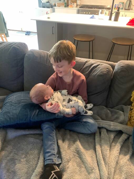BROTHERS: Lewis finally meets big brother Harley after 135 days in hospital. Picture: supplied