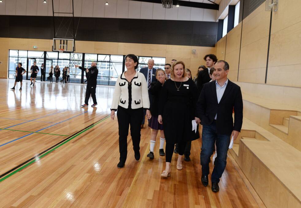 COURT: Buninyong's Labor candidate Michaela Settle, Phoenix P-12 College principal Karen Snibson and education minister James Merlino inspect the school's new basketball court. Picture: Kate Healy
