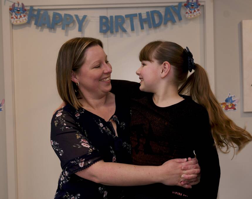 CELEBRATION: Hollie Fowler with her daughter Scarlett, 8, who shares her birthday each year with World MS Day. Picture: Lachlan Bence