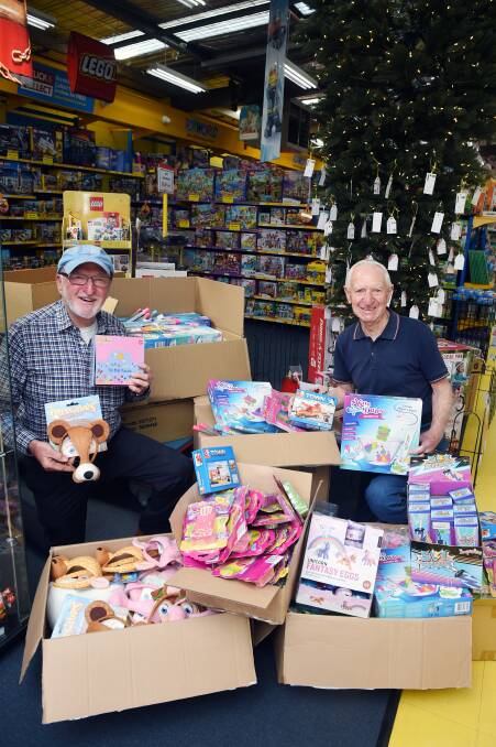CHRISTMAS: St Vincent de Paul regional president Alan West and Peter Caligari with donations to the 3BA Christmas Appeal to support local families. Picture: Kate Healy