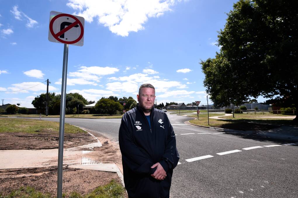 WAITING: Miners Rest Primary parent Glenn Bell at the unfinished school crossing on Dundas Place. Picture: Adam Trafford