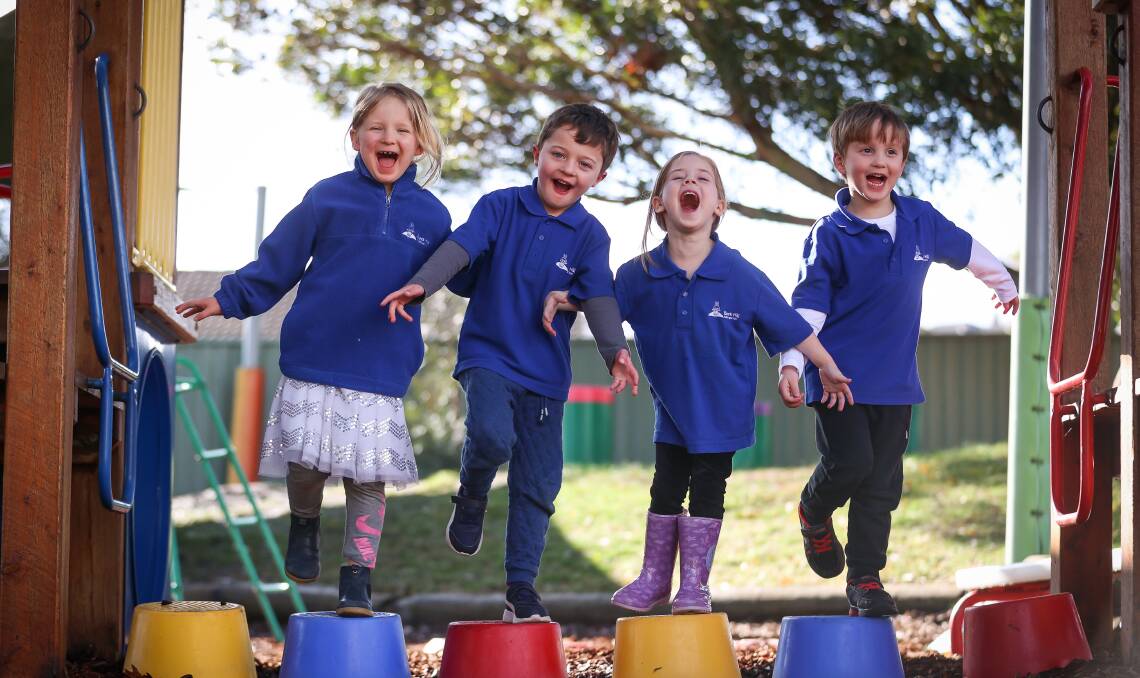 JOY: Black Hill Kindergarten students Millie, Oliver, Isabel and Noah know how much fun kinder can be. Picture: Luke Hemer.