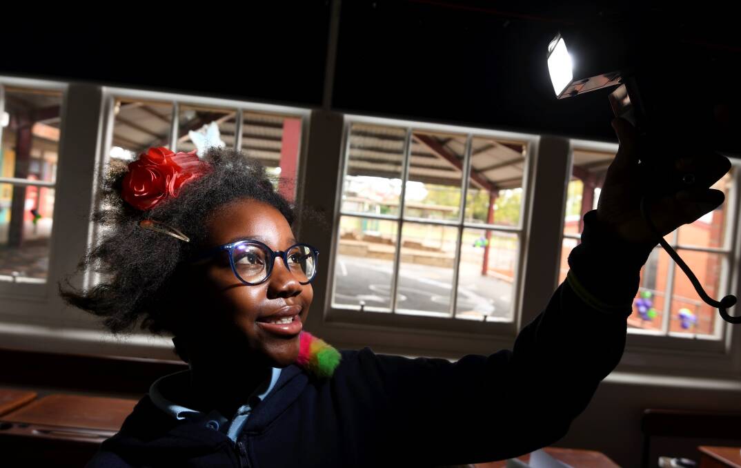 ZANY: Macarthur Street Primary pupil Kito shows off her crazy hair for a fundraiser putting the spotlight on cancer research. Picture: Lachlan Bence
