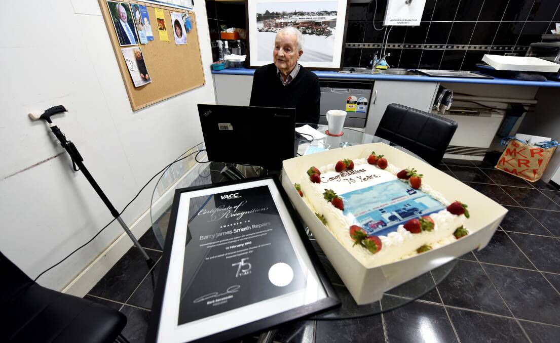 MILESTONE: Barry James celebrates 75 years in the smash repair industry with a cake and certificate from the VACC. Picture: Jeremy Bannister