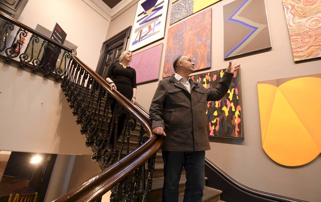 BRIGHT: Art Gallery of Ballarat director Louise Tegart and Matt Haymes inspect the bold colours of the artwork on the newly repainted and refurbished foyer and staircase. Picture: Lachlan Bence Louise Tegart, Matt Mayes.