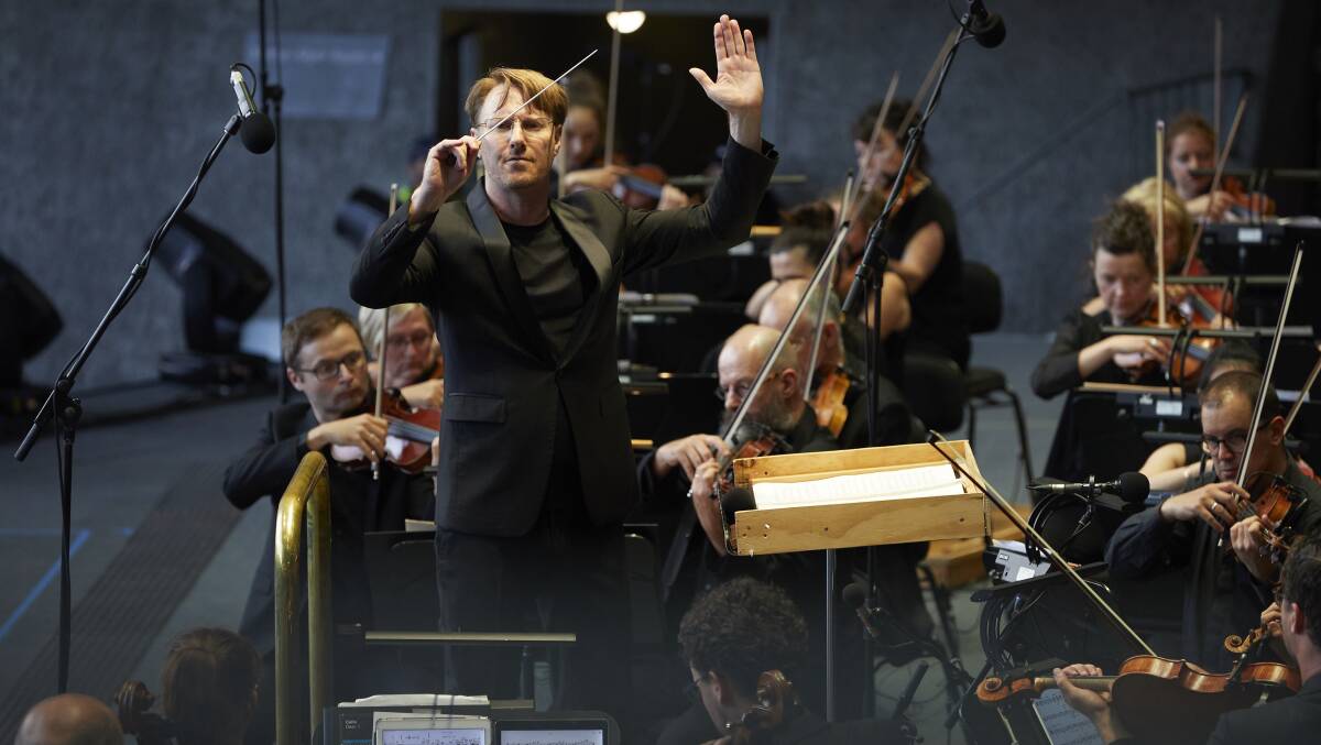 ACTION: Ben Northey leads the MSO during their Sidney Myer Music Bowl performance. Picture: Laura Manariti