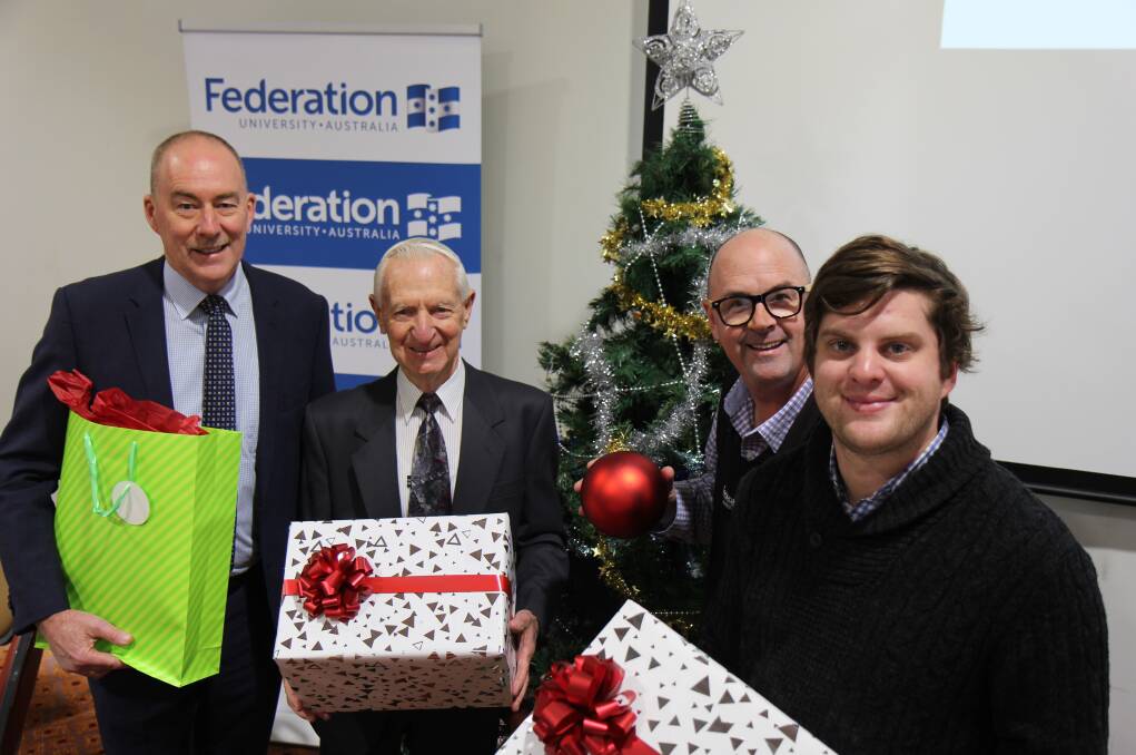CHRISTMAS IN JULY: Trevor Petrie, Christmas in July appeal director Peter Caligari, Colin Marshall and Seb Claassen at the FedUni function. 