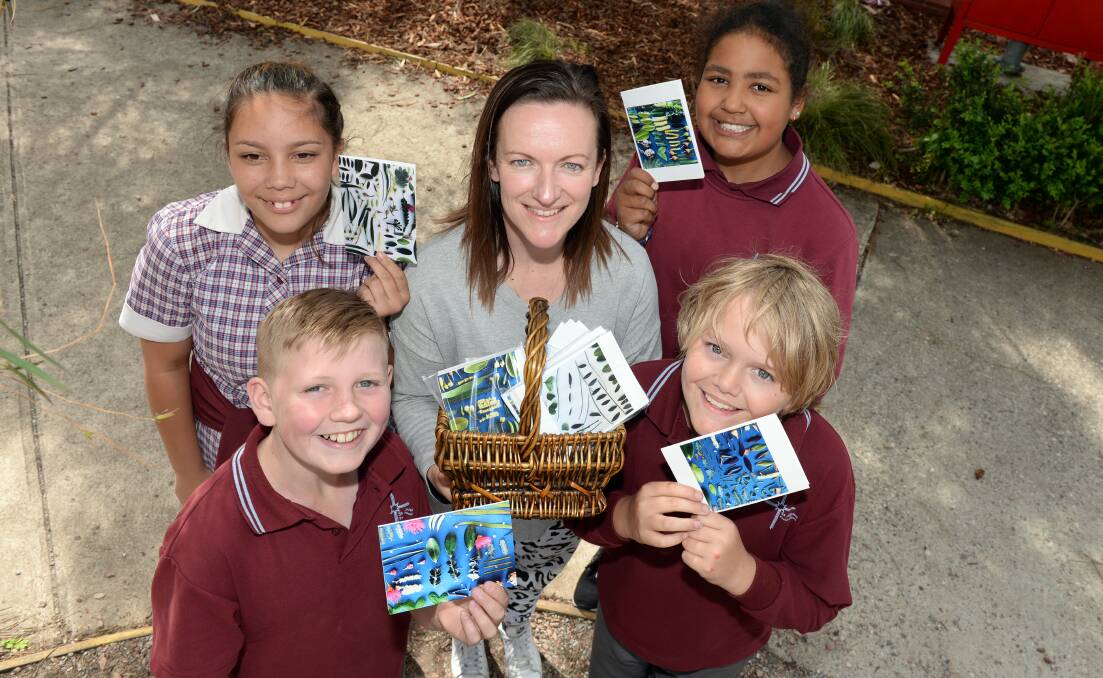 TOGETHER: Sharni (Grade 6), Jet (Grade 5), wellbeing leader Emily Clarke, Ethan (Grade 5) and Sarasa (Grade 5) welcome the new St Alipius Parish School Reconciliation Action Plan. Picture: Kate Healy